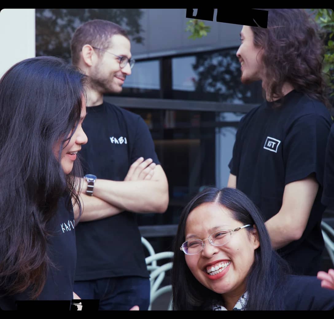 A group of people standing next to each other